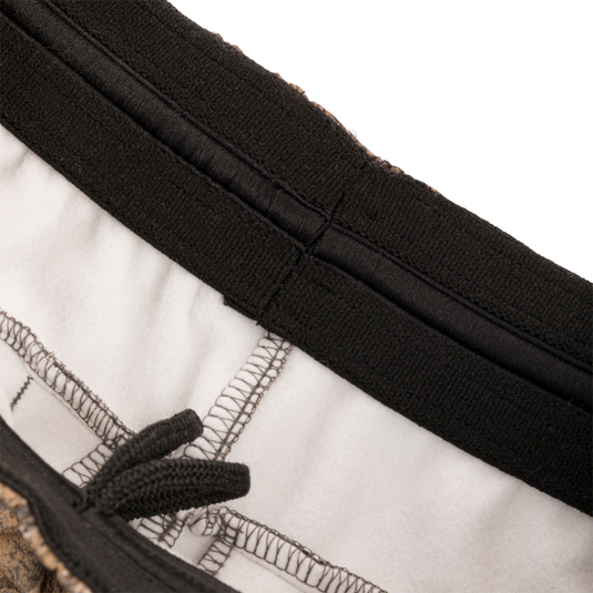 Close-up of Drake Under-Wader Jogger showcasing zipper and stitching details, designed for comfort and durability with tapered legs and multiple pockets.