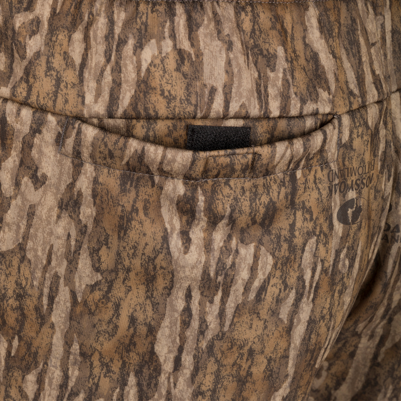 Close-up of Drake Under-Wader Jogger showing detailed camouflage pattern and front slash pocket design.