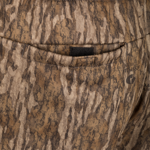 Close-up of Drake Under-Wader Jogger showing detailed camouflage pattern and front slash pocket design.