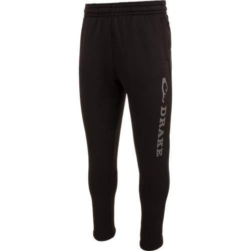 Drake Under-Wader Jogger with white text, featuring tapered legs, front slash pockets, and hook and loop closure back pockets, designed for comfort and durability under waders.