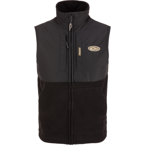 MST Eqwader Vest featuring a logo, Magnattach™ chest pocket, vertical zippered pocket, and breathable fleece lower section, ideal for movement and storage.