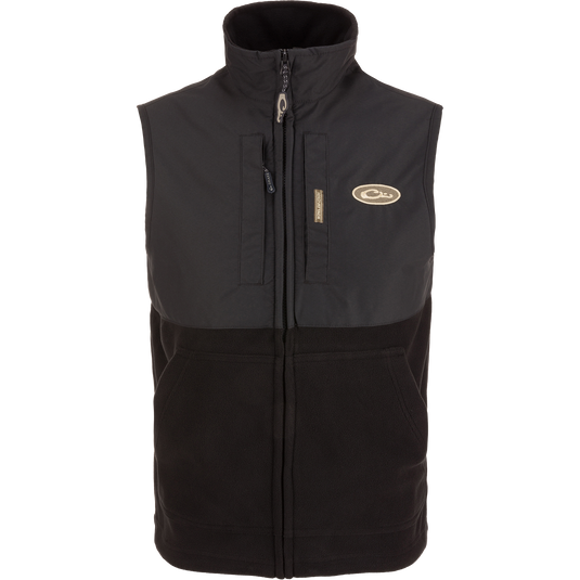 MST Eqwader Vest featuring a logo, Magnattach™ chest pocket, vertical zippered pocket, and breathable fleece lower section, ideal for movement and storage.