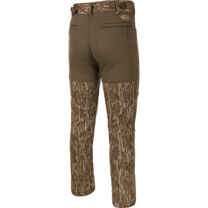 Endurance Jean Cut Wader Pant featuring a camouflage pattern, front slash pockets, rear pockets, and an adjustable waist for comfort and protection.