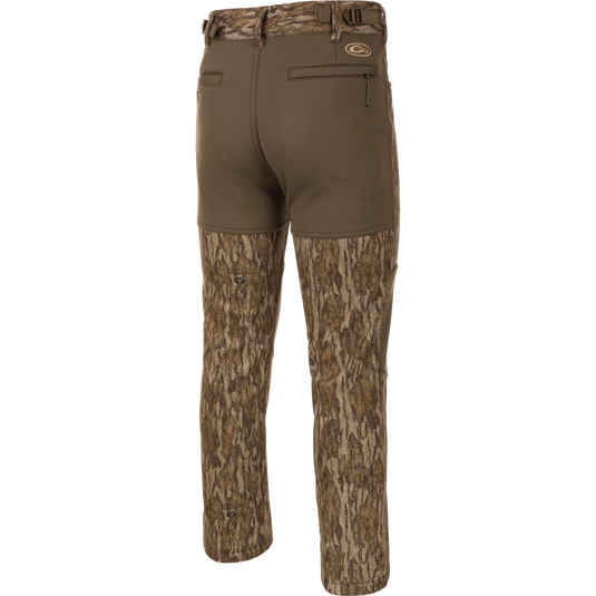 Endurance Jean Cut Wader Pant featuring a camouflage pattern, front slash pockets, rear pockets, and an adjustable waist for comfort and protection.