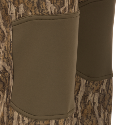 Endurance Jean Cut Wader Pant with camouflage pattern, showcasing front slash pockets, rear pockets, and adjustable waist for hunting comfort and protection.