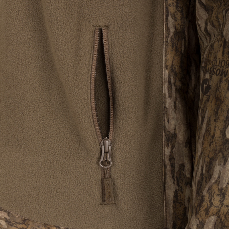 MST Half Zip Eqwader Jacket featuring a close-up view of the high-quality zipper and fabric, showcasing the patented waterproof/breathable technology for superior comfort and performance in harsh conditions.