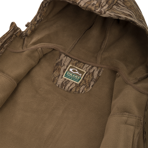 Close-up of the MST Ripstop Softshell Jacket, featuring zippered chest pockets and an adjustable hood for practical use.