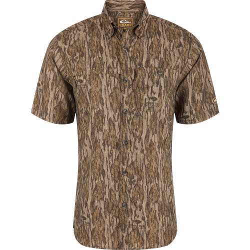 Short-Sleeved Flyweight Camo Hunting Shirt with tree pattern, vented cape back, hidden button-down collar, and multiple zippered chest pockets for functional hunting wear.