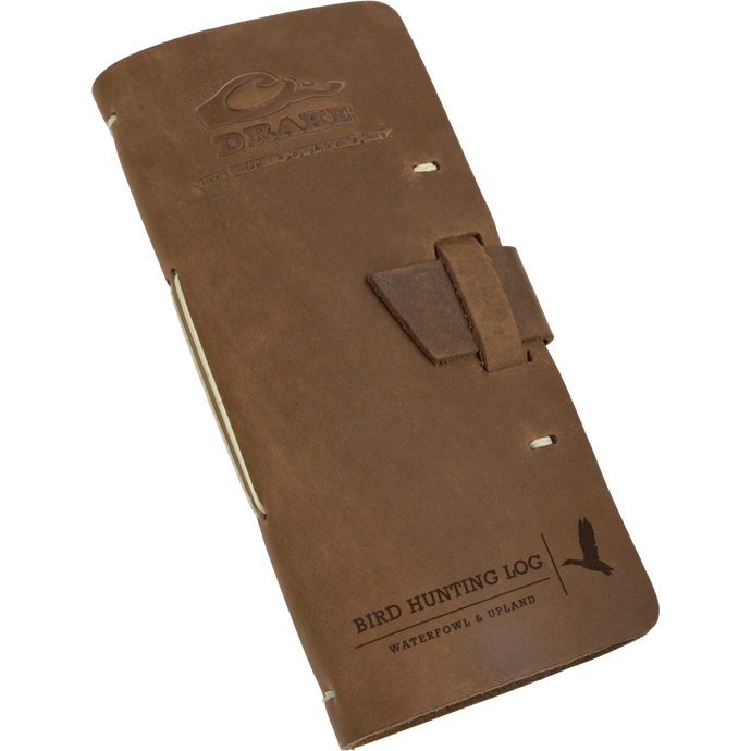 A brown leather case with a buckle, perfect for capturing every detail of your bird hunts. Drake Leather Bird Hunting Log.