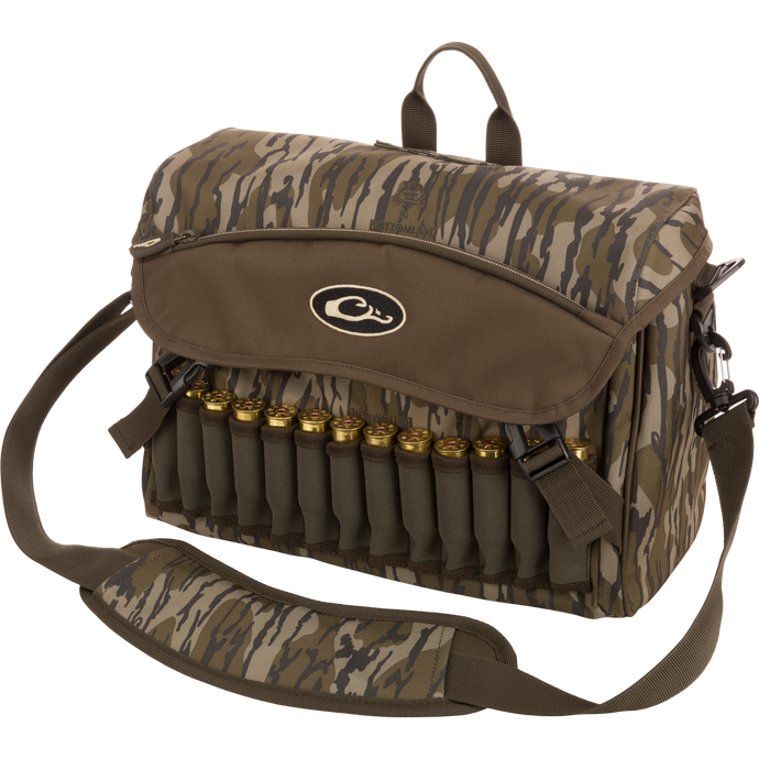 A rugged Shoulder Bag 2.0 by Drake Waterfowl, ideal for guides and outfitters. Features 650 cubic inches of storage, adjustable strap, durable hardware, and various pockets for hunting essentials. Dimensions: 13L x 9H x 5D.