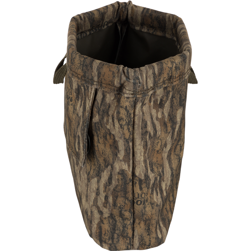 Waterfowler's Shell Bag with camouflage pattern, featuring a spring-open closure, front and rear webbing loops, and brass grommets for drainage.