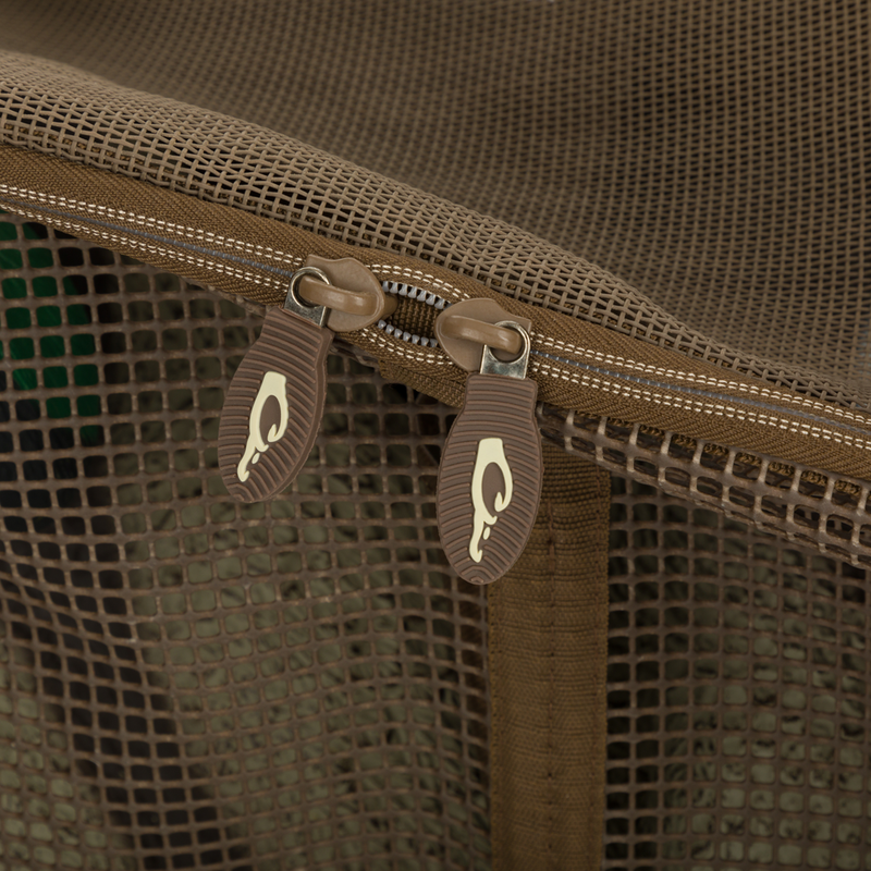 Close-up of zippers on the Drake Floater Series Decoy Bag, highlighting the waterproof, rot-proof vinyl-coated mesh and secure zippered top.