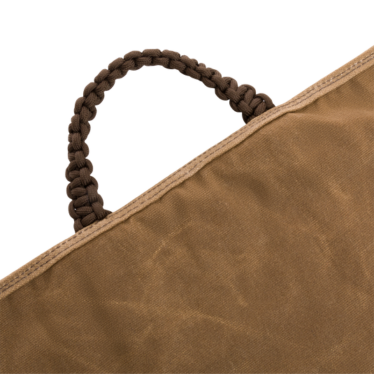 Close-up of the Wax Cotton Gun Sleeve, featuring a braided rope handle and Velcro closure, designed to protect shotguns up to 50 inches.