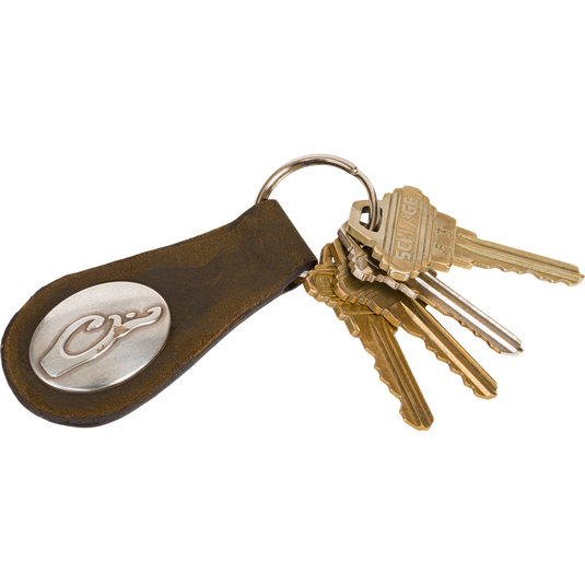 Leather Key Chain featuring a Drake logo on a brushed silver emblem, with a sturdy leather strap and heavy-gauge ring for secure key storage.