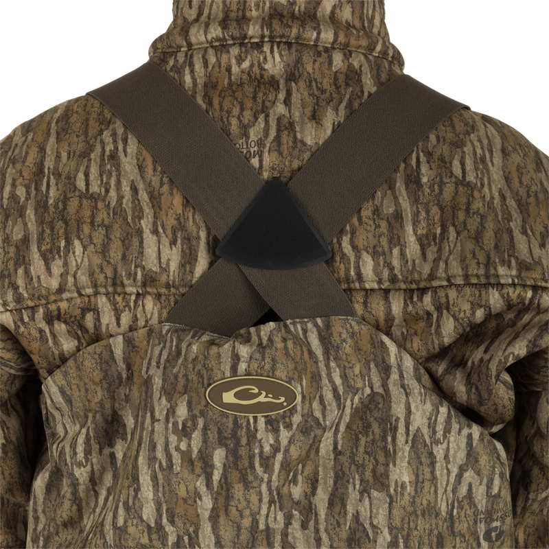 Uninsulated Guardian Elite HND Front Zip Wader - Original Treestand: A person wearing a camouflage jacket, standing in the marsh, wearing the Guardian Elite HND Front Zip Wader.