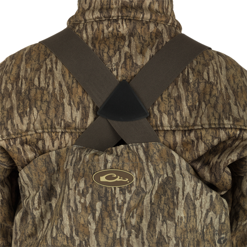 Uninsulated Guardian Elite HND Front Zip Wader - Original Treestand: A person wearing a camouflage jacket, standing in the marsh, wearing the Guardian Elite HND Front Zip Wader.