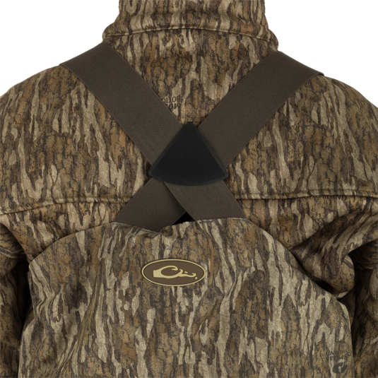 Uninsulated Guardian Elite HND Front Zip Wader - Original Treestand: A person wearing a camouflage jacket, standing in the marsh, wearing the Guardian Elite HND Front Zip Wader.