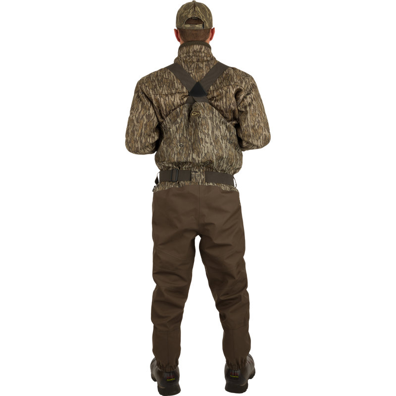 Uninsulated Guardian Elite HND Front Zip Wader - Original Treestand: A man in camouflage clothing wearing the Guardian Elite HND Front Zip Wader, standing confidently in the outdoors.