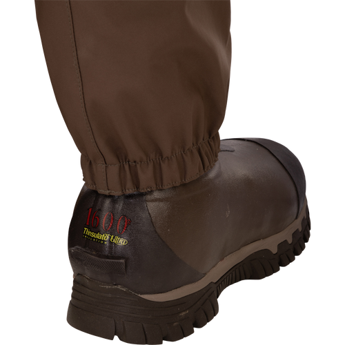 Close-up of the Guardian Elite Hybrid Insulated Front Zip Wader, showcasing its advanced waterproof and breathable fabric, reinforced seams, and Thinsulate® insulated boot lining.