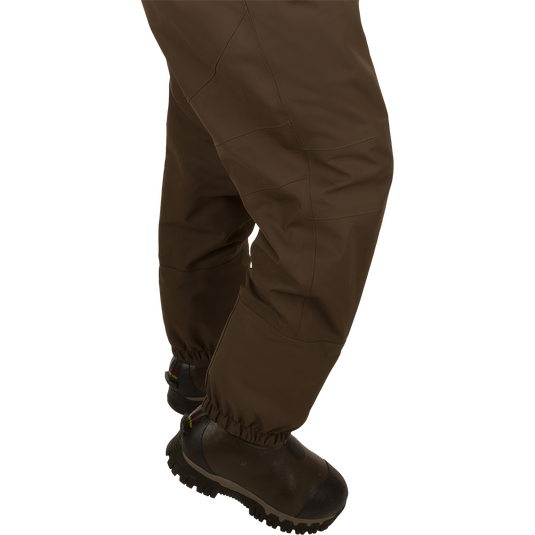 Insulated Guardian Elite HND Front Zip Wader with durable fabrics, reinforced seams, and Thinsulate® boots, shown in close-up on a person's legs and boots.