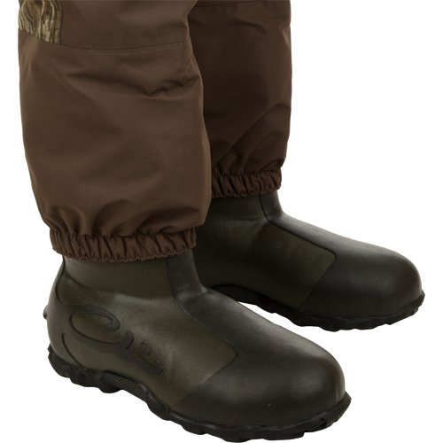 Insulated Guardian Elite Vanguard Breathable Wader - Old School, featuring 3-layer waterproof fabric, LokDown insulation, and 1600g Thinsulate boots. Ideal for hunting and fishing adventures.