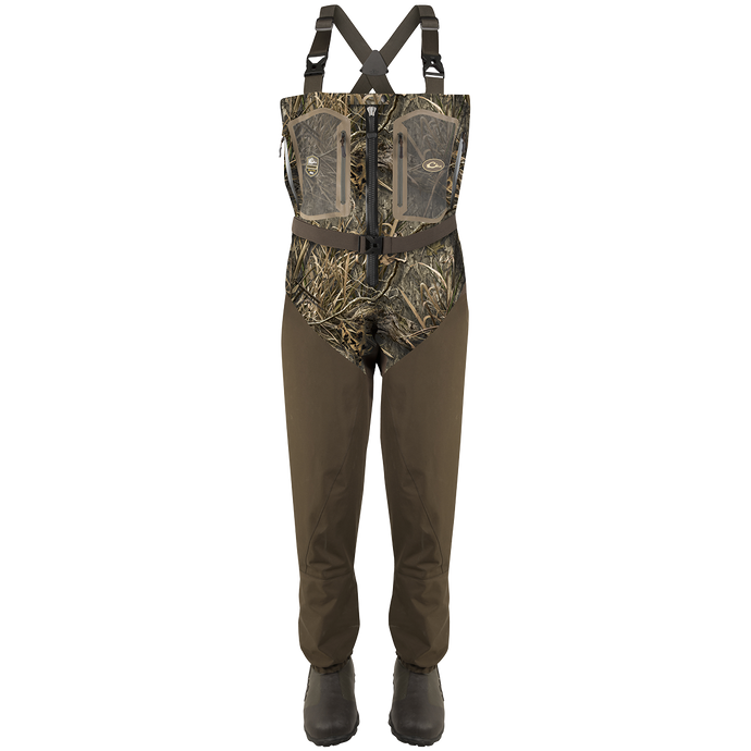 A pair of Guardian Elite Front Zip Insulated Waders with camouflage overalls, rugged boots, and adjustable shoulder straps.