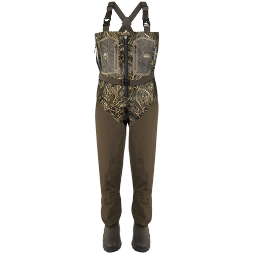 A pair of Guardian Elite Front Zip Insulated Waders with camouflage overalls, rugged boots, and adjustable shoulder straps.