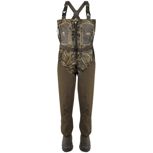 A pair of Guardian Elite Front Zip Insulated Waders with camouflage overalls, rugged boots, and adjustable shoulder straps.