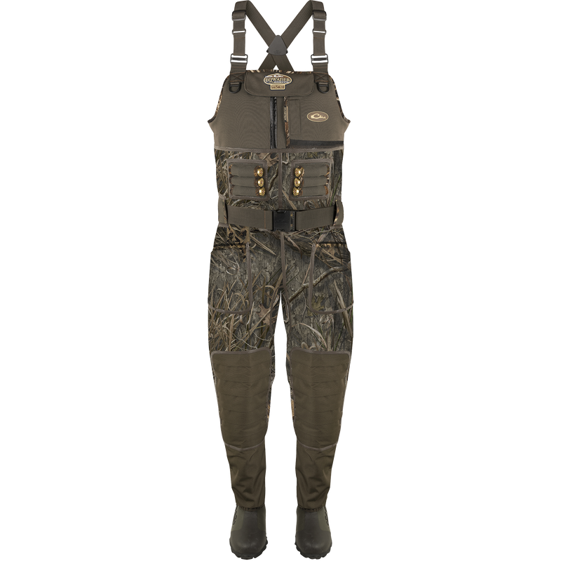 Buckshot Eqwader 1600 Neoprene Wader 3.0 displayed with camouflage overalls, emphasizing its durable construction and comprehensive seam protection for waterfowl hunting.