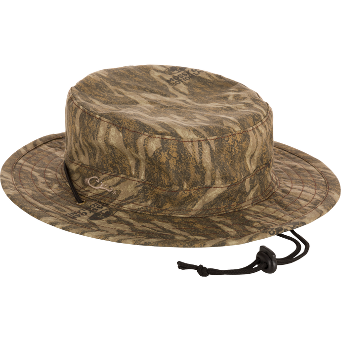 Close-up of the DUK Boonie Hat, featuring a full brim, adjustable drawstring, and lightly structured, soft cotton fabric for all-weather protection.