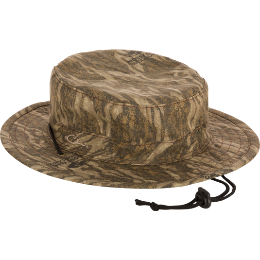 Close-up of the DUK Boonie Hat, featuring a full brim, adjustable drawstring, and lightly structured, soft cotton fabric for all-weather protection.
