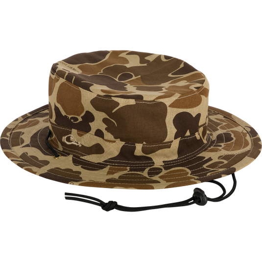 Alt text: DUK Boonie Hat with camouflage pattern, black adjustable drawstring, and full brim for 360-degree sun protection.