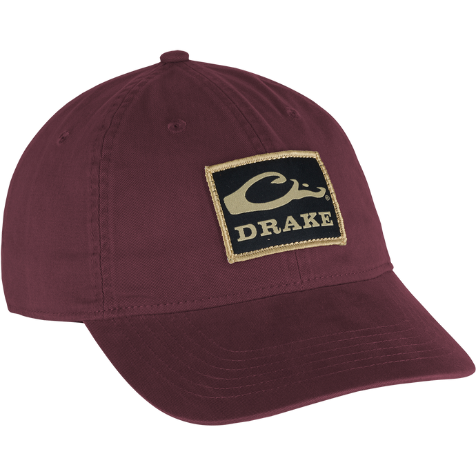 Cotton Twill Patch Cap featuring a logo, low profile, contoured bill, and adjustable brass buckle strap, crafted from 100% cotton twill for comfort and style.