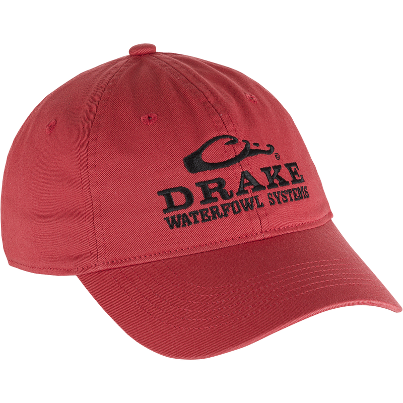 Cotton Twill Systems Cap featuring black text, low-profile design, contoured bill, and brass buckle backstrap, ideal for stylish, comfortable outdoor wear.