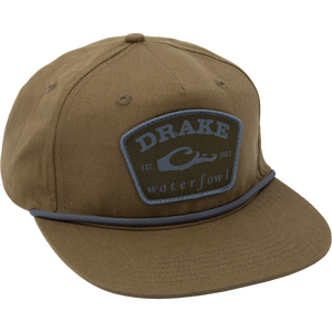 Drake X Lost Hat Drake Patch Goat Rope Cap featuring a logo patch, unstructured design, flat visor, and adjustable snap-back closure for a custom fit.