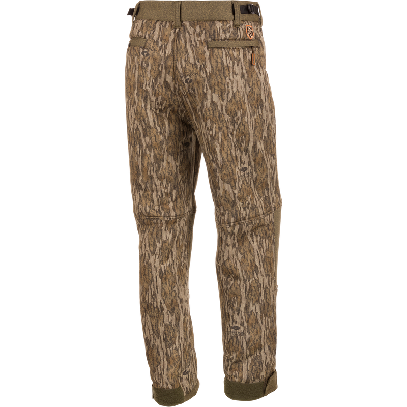 Alt text: Youth Silencer Pant With Agion Active XL, camouflage design with multiple pockets, adjustable waist and ankle, ideal for quiet and comfortable deer stand hunting.