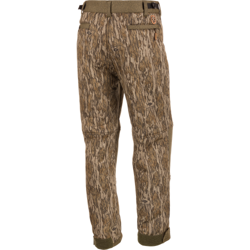 Alt text: Youth Silencer Pant With Agion Active XL, camouflage design with multiple pockets, adjustable waist and ankle, ideal for quiet and comfortable deer stand hunting.