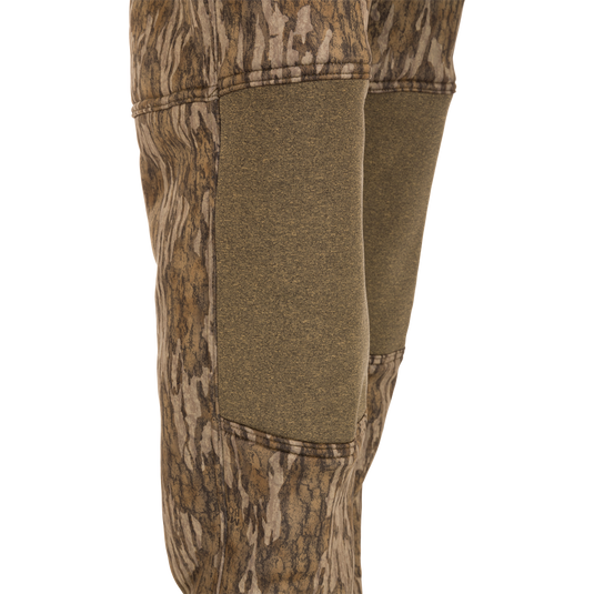 Youth Silencer Pant With Agion Active XL: Close-up of camouflage hunting pants featuring adjustable waist, ankle straps, and front and rear pockets, designed for quiet, comfortable deer stand use.