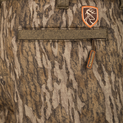 Close-up of Youth Silencer Pant with Agion Active XL, featuring camouflage fabric, adjustable waist, and scent control technology, designed for quiet, comfortable hunting.