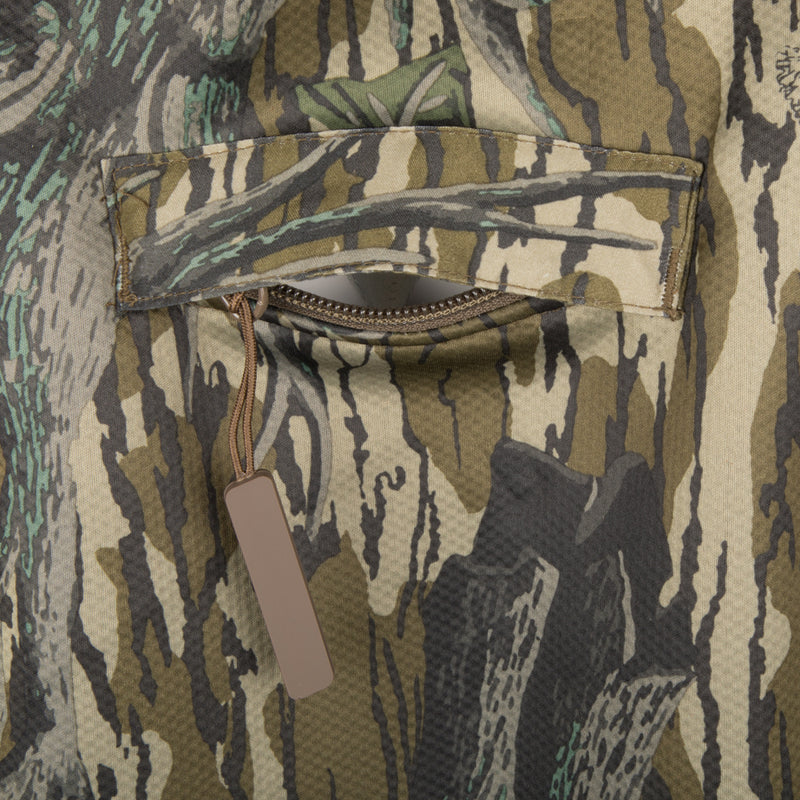 Close-up of a pocket on the Silencer Full Zip Jacket Full Camo with Scent Control, featuring a tag and durable fabric.