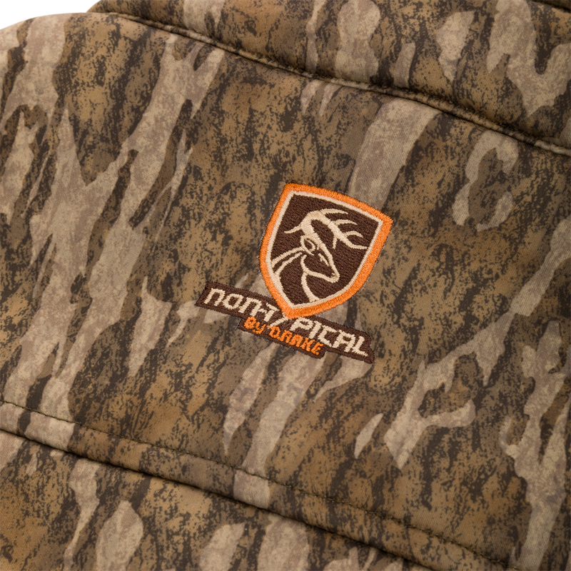 Close-up of the Youth Silencer Full Zip Jacket Full Camo with Scent Control, highlighting the durable camouflage fabric and visible chest pocket zipper.