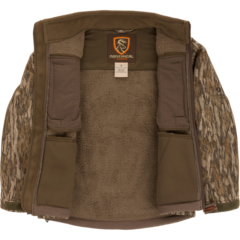 Youth Silencer Full Zip Jacket Full Camo with Scent Control, featuring a deer logo patch, vertical chest pockets, and durable, quiet fabric for big game hunting.