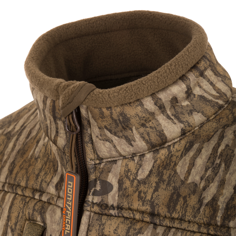 Close-up of the Youth Silencer Full Zip Jacket Full Camo with Scent Control, highlighting the durable fabric, vertical chest pockets, and zipper details.