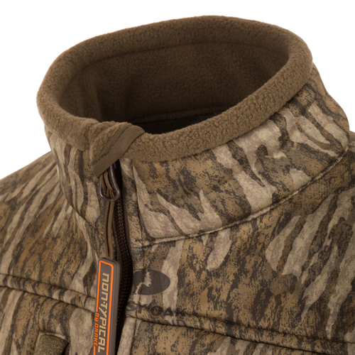 Close-up of the Youth Silencer Full Zip Jacket Full Camo with Scent Control, highlighting the durable fabric, vertical chest pockets, and zipper details.