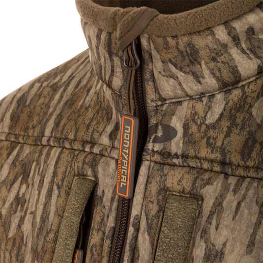 Close-up of the Youth Silencer Full Zip Jacket Full Camo with Scent Control, highlighting the durable fabric, zipper, and vertical chest pocket with lanyard.