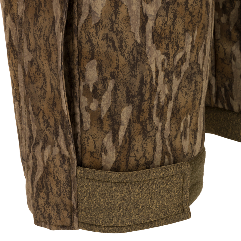 Close-up of Women’s Silencer Bib with Agion Active XL, showcasing camouflage fabric, front slash pockets, and adjustable waist. Ideal for mid-season hunting.