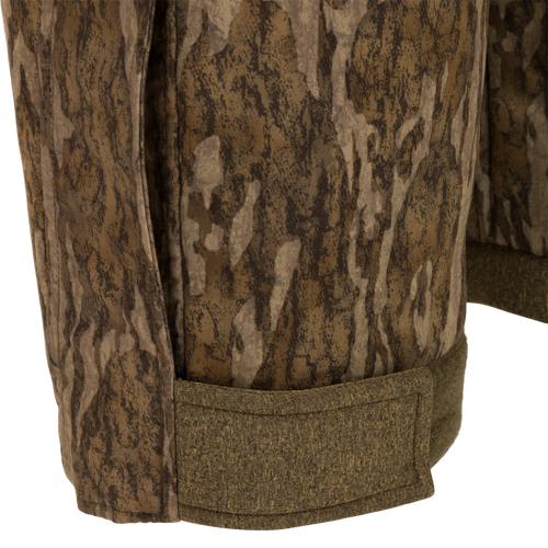 Close-up of the Youth Silencer Bib With Agion Active XL, showcasing camouflage fabric and durable construction, ideal for warmth and scent control during hunting.