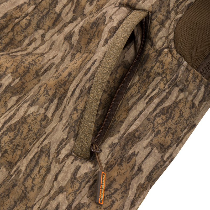 Close-up of the zipper on the Youth Silencer Bib With Agion Active XL, showcasing durable fabric and scent control technology for hunting.