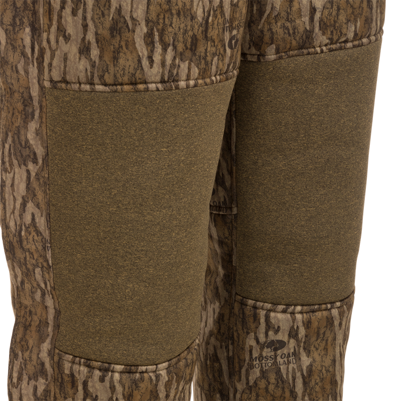 Close-up of Youth Silencer Bib with Agion Active XL, highlighting durable fabric and vertical pockets designed for hunting gear.