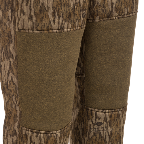 Close-up of Youth Silencer Bib with Agion Active XL, highlighting durable fabric and vertical pockets designed for hunting gear.